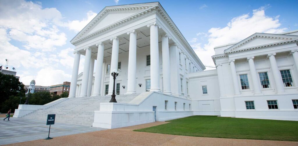 Virginia State Capitol building in Richmond with white columns and wide front steps.