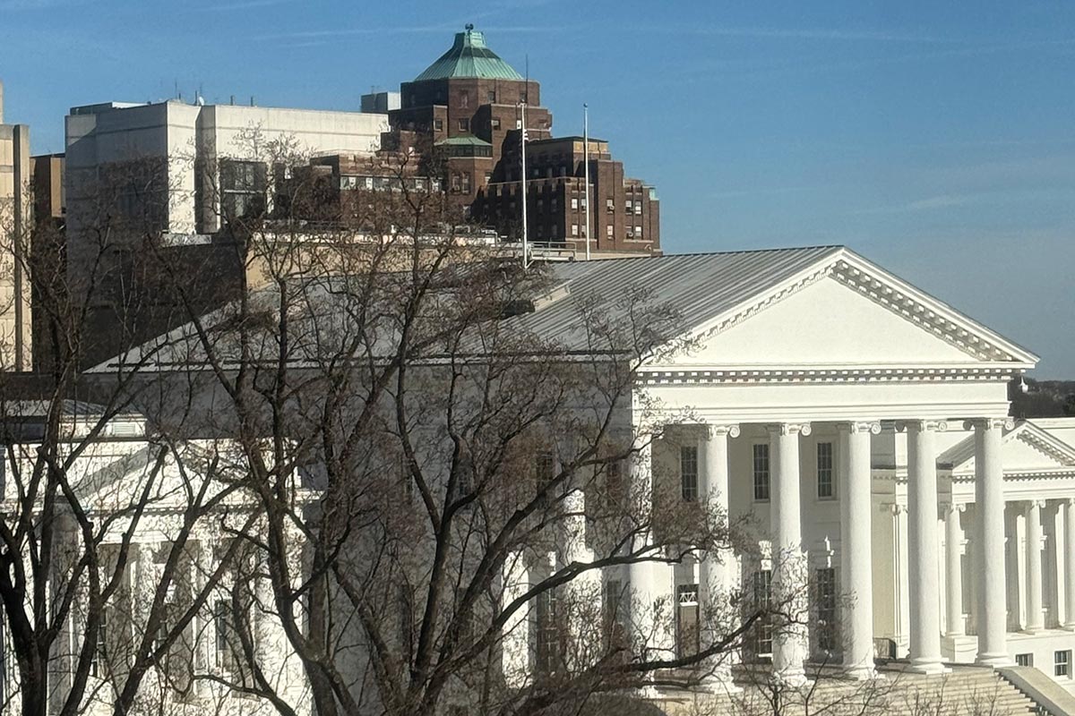 The Virginia Capitol building, a historic structure, features classical architecture and is surrounded by landscaped grounds.